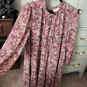 Mock neck puff sleeves, ruffled skirt, floral peasant dress. Button detailing.